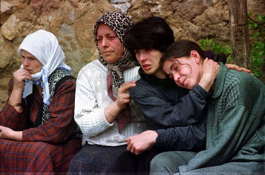 Relatives grieve at the funerals of 18 year old Miradije Kukaj and 12 year old Zinete Avdiu, who were killed by a landmine as they tried to escape from Kosovo. Gornje Blace, near the Macedonian border...