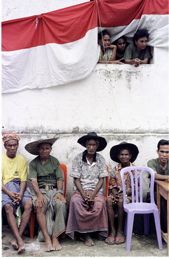 Green-shirted Mahidi militia and villagers forced to attend a rally. Mahidi's slogan is "Dead or alive, Integration with Indonesia".
