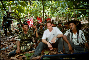 Martin Adler in a self portrait with Commander Abdullah Syafi and other GAM fighters. The GAM (Gerakan Aceh Merdeka - Free Aceh Movement) have been fighting for Acehnese independence since 1976.