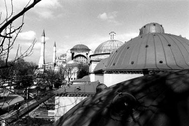 The dome of the Roxelane hamam in the Sultanamet area. Once the biggest hamam in the world, it is now used as a carpet emporium. In the distance is the Church of Santa Sofia. Turkish baths.