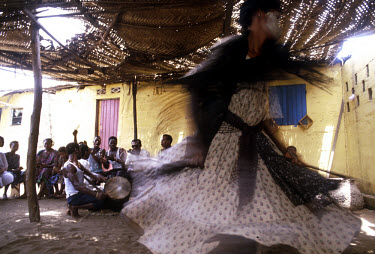 A dancer performing in a voodoo trance ceremony.
