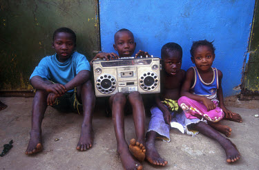 Kids listening to the radio.