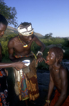 Sangoma initiation ceremony. A sangoma is a practitioner of herbal medicine, divination and counselling in traditional Nguni societies.