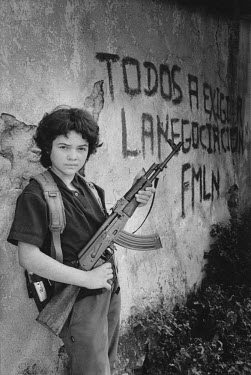 13 year old guerilla fighter with the FMLN in Hacienda Montecillo. Her nomme de guerre is Eva.