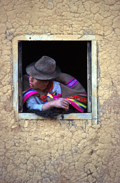 Quechua Indian woman watching bullfight.