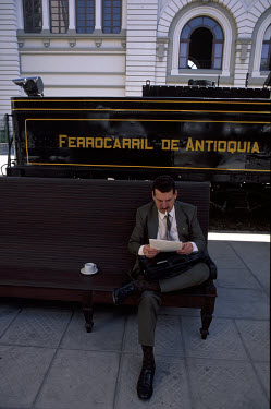 Businessman reading his newspaper.