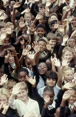 Waving children from a mixed race school.