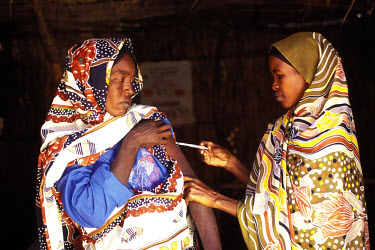 A woman being immunised at a rural health clinic.