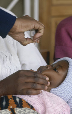 Oral polio vaccination for baby at Mtendere immunisation post.