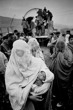 Ethnically Tajik internally displaced persons (IDPs) escape across the Hindu Kush fleeing the Taliban onslaught.