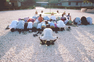 Muslims doing evening prayer.