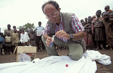 Italian Dr Sabatinelli testing mosquitoes for malaria in a refugee camp.
