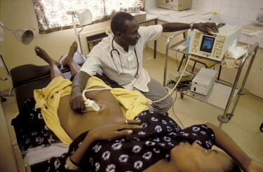 Woman having an ultrasound scan in a clinic in an SOS Children's village.