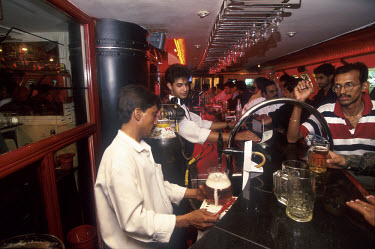 Bangalore, the city which is at the heart of India's new economy, is also perhaps the most Westernised part of India. This is one of many bars in the city centre, serving pitchers of beer to middle cl...