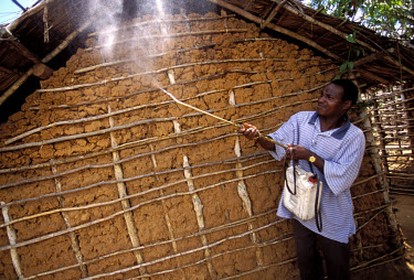 Malaria research: spraying houses to collect adult mosquitoes.