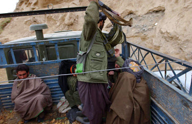 Close to the front line, a small group of Taliban prisoners of war have been sitting in a cold truck all day. The Northern Alliance are waiting to exchange them for the bodies of 11 of their dead comr...