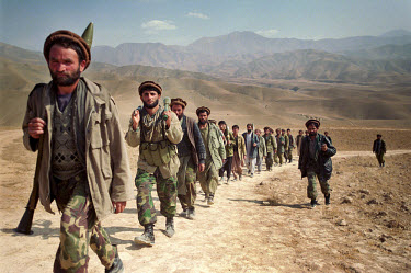 Northern Alliance soldiers on the march towards the Taloqan front line.