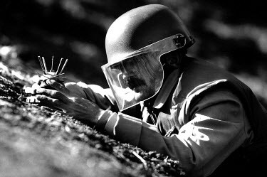 A worker from the Mines Advisory Group, a British-based NGO, defuses a Valmara VS69 landmine. Millions of landmines and unexploded ordnance litter the former front line in the Iran/Iraq war, still kil...