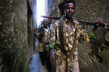 Young militia men patrolling the streets of the old town. Somalia has been without a central government since 1991. Instead, warlords supported by heavily armed militias have ruled the country.