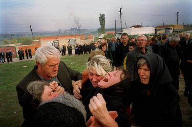 The wife of Radovan Ognjenovic, a 40 year old Serb, mourns at his funeral. He was killed after his tractor drove over an anti tank mine newly planted on a road used exclusively by Serbs.