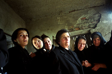 Relatives of Radovan Ognjenovic, a 40 year old Serb, mourn at his funeral. He was killed after his tractor drove over an anti tank mine newly planted on a road used exclusively by Serbs.