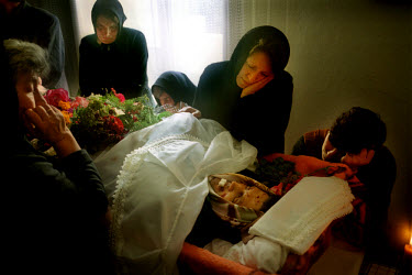 Relatives of Radovan Ognjenovic, a 40 year old Serb, mourn before his funeral. He was killed after his tractor drove over an anti tank mine newly planted on a road used exclusively by Serbs.
