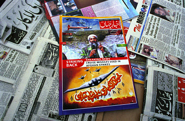 Local newspapers and magazines react to the US air strikes against the Taliban and Osama Bin Laden. In the centre is the Akhbar -e-Jehan news magazine, the largest circulation Urdu language magazine i...