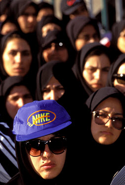 A Nike cap stands out among the hijabs in the line-up for the start of a women's mini-marathon during National Sports Week. The authorities regularly launch crackdowns on what is known as 'bad hijab'...