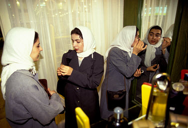 Women shopping for cosmetics in this duty-free port in the Persian Gulf.