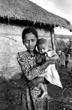 Young mother and child, among thousands of people displaced by cyclones.