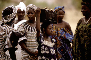 Tuareg girl with a radio.