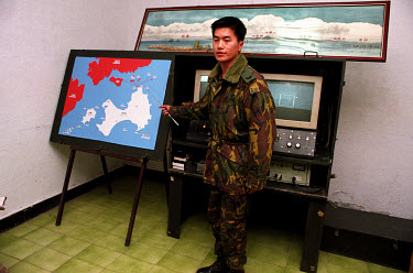 Taiwanese military Captain pointing out just how close Kinmen Island (white) is to China (red). During the height of the cold war in the 1950s and 60s Kinmen suffered some of the heaviest artillery bo...