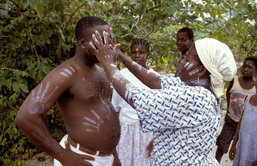 Traditional healer giving treatment.