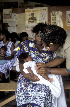 Baby having a check-up in a child welfare clinic.