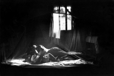 Malaria prevention: mother and child sleeping under a mosquito net. The recent discovery of huge oil reserves in the Gulf of Guinea is set to make the  country one of the richest per capita in the wor...