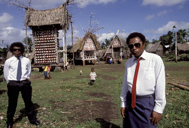 Chief Alan K Dabwai and his nephew dress up to go to church in Tukwaukwa, Kiriwina.