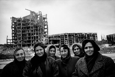 A women's work brigade paid by the Russian federal authorities to sweep the streets of the war-ravaged city centre.