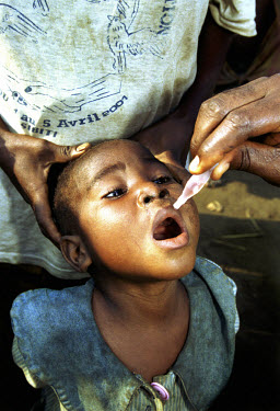 Vaccination team visits a pygmy settlement on a National Immunisation Day (NID) to administer polio vaccine.