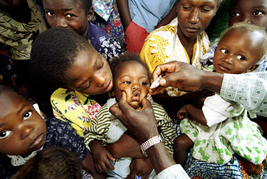 Vaccination team visits a pygmy settlement on a National Immunisation Day (NID) to administer the polio vaccine.
