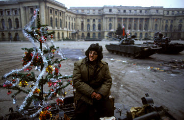 The incongruous sight of a tank decorated with a Christmas tree in the city's central square. The Romanian popular revolt and coup of 22nd-25th December 1989 represented a decisive moment in the colla...