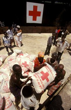 Unloading Red Cross food aid in Mogadishu harbour.In 1991 President Barre was overthrown by opposing clans, but they failed to agree on a replacement and plunged the country into lawlessness and clan...