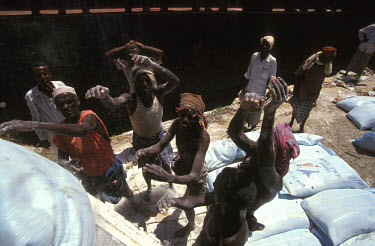 Unloading food aid in Mogadishu harbour.In 1991 President Barre was overthrown by opposing clans, but they failed to agree on a replacement and plunged the country into lawlessness and clan warfare....