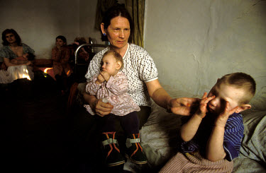 Nadia Zagozina and her daughters Zina, 4 and Luba, 18 months, both of whom suffer from problems with the central nervous system. They live in the village of Mostic, north of the epicentre of the explo...