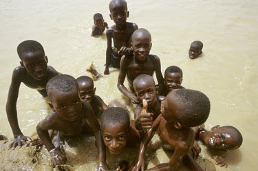 Children play in the Senegal River. The muddy waters are a source of life in the midst of the desert.
