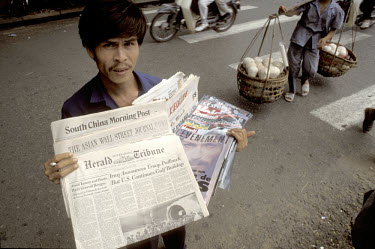 Street vendor selling international newspapers and magazines.