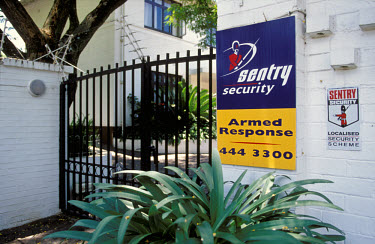 To guard against crime, the homes of the wealthy minority are protected by private armed security companies.