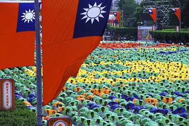 Sea of students wearing coloured umbrella hats as part of Taiwan's National Day celebrations.