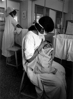 Mother breastfeeding her newborn child in the ward for premature babies at the TATA Memorial Hospital, which is financially supported by the Tata corporation.