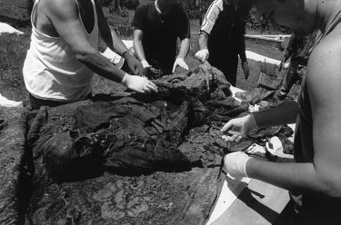 The team from the Commission for Missing Persons works on identifying the remains of victims of ethnic cleansing from 1992. They were shot on their doorsteps by Serbs from the next village at the begi...
