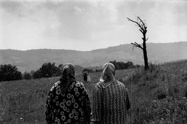 The women of the Baltic family watch members of the commission for missing persons recover the remains of their menfolk who were killed in an ambush on this hillside while trying to escape from Srebre...